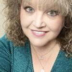 Christine J Scott